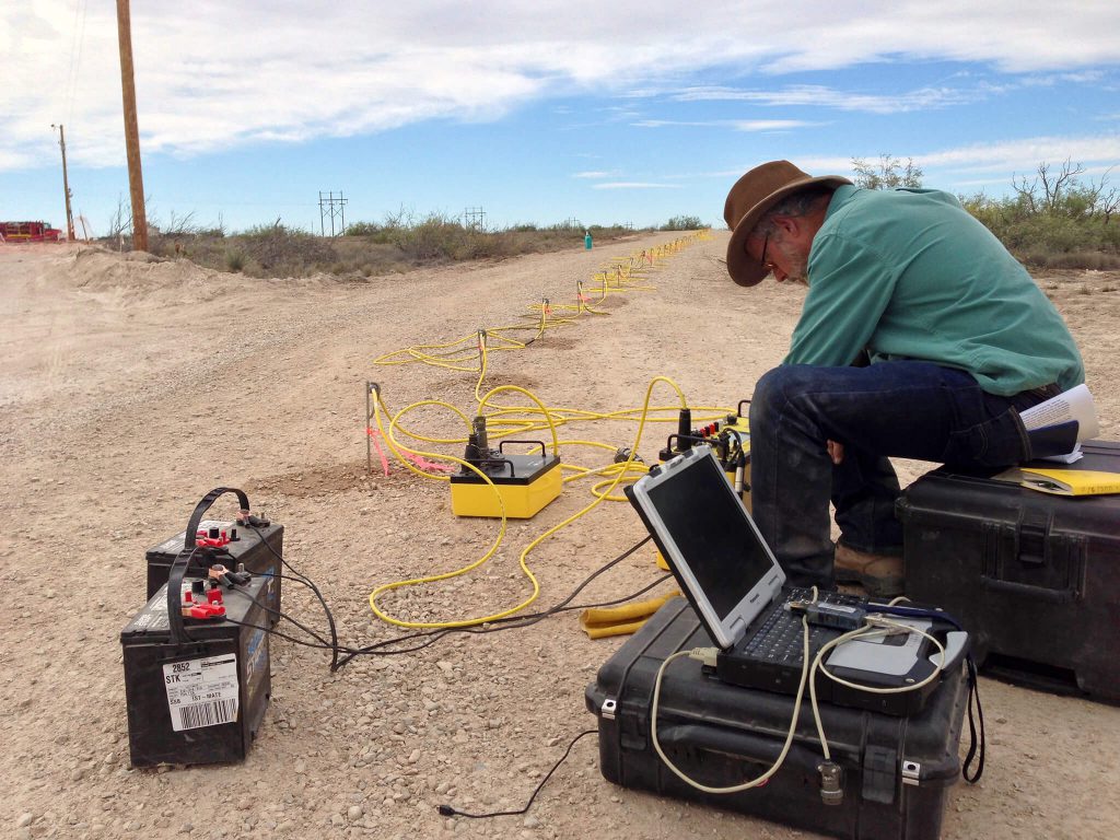 Dr. Lewis Land processing geophysical data from a cave sinkhole for land research.